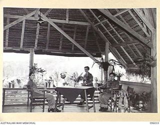 WUNUNG, NEW BRITAIN. 1945-09-04. AUSTRALIAN ARMY NURSING SERVICE SISTERS RELAXING IN A CORNER OF THE SISTERS' MESS, 105 CASUALTY CLEARING STATION. IDENTIFIED PERSONNEL ARE:- SISTER K.H. BARNES (1); ..