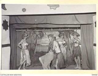 LAE AREA, NEW GUINEA. 1945-08-11. A DANCE AND STAGE PRESENTATION WAS HELD AT THE LAE BASE SUB-AREA SERGEANTS' MESS. SHOWN, THE "HAWAIIAN INTERLUDE" MEN'S BALLET