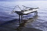 Oceania, canoe on stilts off island in South Pacific