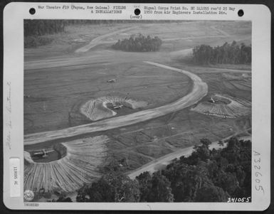 North American B-25s in revetments on Air Strip at Dobodura, Papua, New Guinea. 21 June 1943. (U.S. Air Force Number 119095AC)