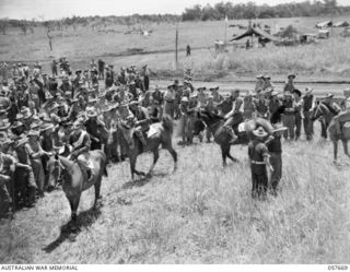 SOPUTA, NEW GUINEA. 1943-10-09. COMPETITORS IN THE FIRST RACE ARE SHOWN IN THE BIRD CAGE AT A RACE MEETING CONDUCTED BY THE HQ 11TH AUSTRALIAN DIVISION