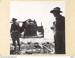 MUSCHU ISLAND, NEW GUINEA, 1945-09-11. TRUCK LOADED WITH THE GEAR OF JAPANESE PERSONNEL BACKING OFF BARGE AT MUSCHU ISLAND. AN ADVANCE PARTY OF 63 OFFICERS AND OTHER RANKS OF THE JAPANESE ARMY AND ..