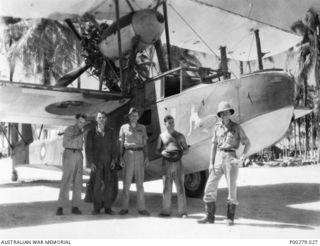 ADMIRALTY ISLANDS, PACIFIC OCEAN. C. 1944-09. PILOT DON WATSON (FAR RIGHT) BASED IN THE ADMIRALTY ISLANDS WITH 71 WING FOR AIR-SEA RESCUE DUTIES. NOTE THE SUPERMARINE WALRUS AMPHIBIAN AIRCRAFT IN ..