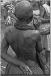 Mortuary ceremony: mourning woman with shaved head