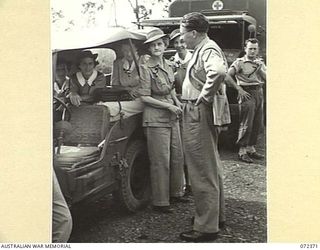 BISIATABU, NEW GUINEA. 1944-04-19. THE HONOURABLE E.J. WARD (1), MINISTER FOR EXTERNAL TERRITORIES IN THE AUSTRALIAN GOVERNMENT, WITH NURSES FROM THE 47TH CAMP HOSPITAL, AUSTRALIAN ARMY NURSING ..