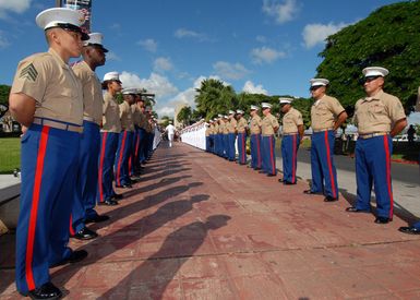 A U.S. Navy Chaplain assigned to Commander, Navy Region Hawaii, checks the ranks of an honor cordon for USS ARIZONA survivors on Dec. 5, 2006, before an official welcome to the USS ARIZONA Memorial Visitors Center at Pearl Harbor, Hawaii. (U.S. Navy PHOTO by Mass Communication SPECIALIST 1ST Class James E. Foehl) (Released)