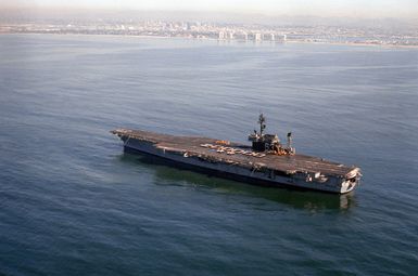 A port quarter view of the USS KITTY HAWK (CV-63) as crewmen form the number "200,000" on the flight deck. AN S-3A Viking has just made the 200,000th aircraft landing aboard the aircraft carrier