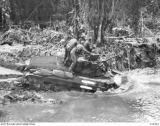 A Matilda tank of B Squadron, 2/4th Armoured Regiment crosses the Puriata River en route to the Hiru Hiru front