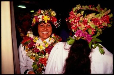 Women wearing 'ei upoko (head wreaths), Cook Islands