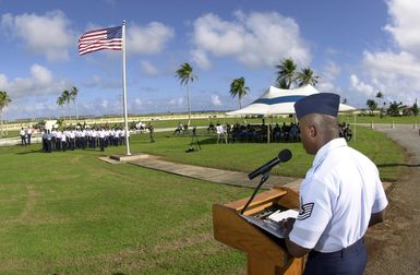 US Air Force (USAF) Technical Sergeant (TSGT) John Lester, 36th Mission Support Squadron (MSS), reads the names of the 33 Airmen killed during the Linebacker II Campaign as part of the ceremony held at Andersen Air Force Base (AFB), Guam. In the formation, beyond the flag, 33 members from Andersen's Network 56, an organization for STAFF and Technical Sergeants, representing the 33 airmen killed during the Campaign. As each name is called a member of the formation comes to attention to representing that person