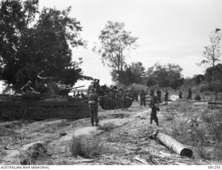 KALIMBOA, AITAPE-WEWAK SECTOR, NEW GUINEA. 1945-04-26. MEMBERS OF A COMPANY, 2/3 INFANTRY BATTALION AND 2/4 ARMOURED REGIMENT MATILDA TANKS, AT CHOLIAL VILLAGE DURING THE BATTALION'S COASTAL ..