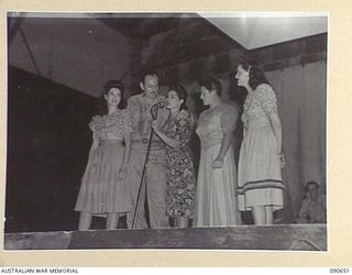 TOROKINA, BOUGAINVILLE. 1945-04-14. THE BOB DYER CONCERT PARTY IN ONE OF THEIR NUMEROUS SKETCHES ENTERTAINING TROOPS AT BOSELY FIELD. IDENTIFIED PERSONNEL ARE:- DOLLY MAC (1); BOB DYER (2); ELVA ..