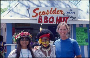 Performer from Papua New Guinea with tourists, Sixth Festival of Pacific Arts