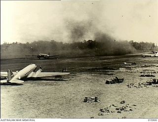 Nadzab, New Guinea. 1943-10-01. The airstrip in the Markham Valley, with US transport aircraft raising clouds of dust as they land and take off