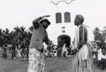 Historical reconstitution of the arrival of Fao, an evangelist, on Lifou in 1842 : Fao explaining his religion to the chief's messenger, in front of the church of Chepenehe