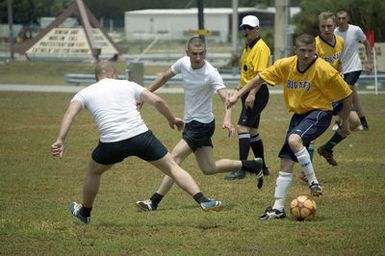 The US Navy (USN) Varsity Soccer team plays against the Russian Federation Navy (RFN) Soccer team, in an exhibition match at Blue Jacket Field, at Santa Rita, Guam (GU). RFN ships are in Guam participating in Exercise PASSEX 06, an exercise designed to increase interoperability between the two navies while enhancing the strong cooperative relationship between Russia and the United States