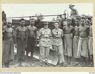 LAE, NEW GUINEA, 1945-05-06. LIEUTENANT-COLONEL M.J. SPENCER, ASSISTANT CONTROLLER OF AUSTRALIAN WOMEN'S ARMY SERVICE (1), AND STAFF-SERGEANT O.M.G. EDWARDS, COMPANY QUARTERMASTER SERGEANT (2), ..