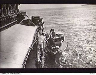 NAURU ISLAND. 1945-09-13. THE LAUNCH OF THE JAPANESE SURRENDER ENVOY DRAWING ALONGSIDE THE ROYAL AUSTRALIAN NAVY VESSEL HMAS DIAMANTINA