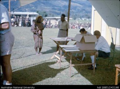 Woman and child waiting to vote