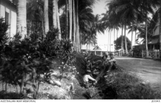 THE GARRISON AT MADANG OCCUPYING THE TRENCHES FACING THE SEA, AS NATIVES HAD REPORTED THE APPROACH OF A GERMAN CRUISER, WHICH TURNED OUT TO BE THE OILER ESCORTED BY THE "YARRA". (DONATED BY ..