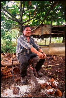 Man processing coconuts,Tonga