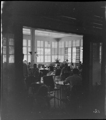 Papua Hotel dining area with group of unidentified people, Port Moresby, Papua New Guinea