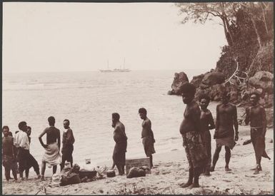 Local men on the beach at Dorig with Southern Cross in background, Santa Maria, Banks Islands, 1906 / J.W. Beattie
