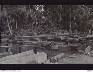MILNE BAY, NEW GUINEA, 1943-07-12. ROUTE 3 BRIDGE ACROSS LAVIAM CREEK, BEING CONSTRUCTED BY THE 21ST AUSTRALIAN ARMY FIELD COMPANY