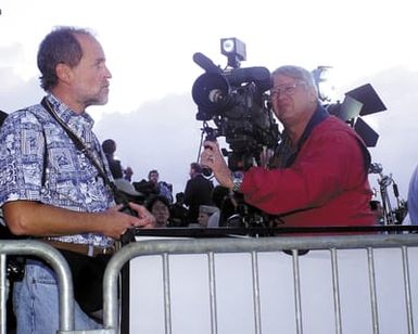 Members of the local News Media set up to cover the return of the Crew from the USN EP-3 Aries II aircraft involved in the March 31st accident with a Chinese F-8 aircraft upon their arrival at Hickam AFB, Hawaii during Operation VALIANT RETURN. The EP-3 crew members were detained in China for 17 days prior to being released