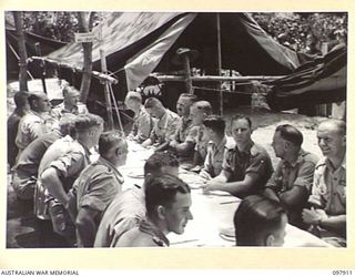 RABAUL, NEW BRITAIN. 1945-10-10. MAJOR GENERAL K.W. EATHER, GENERAL OFFICER COMMANDING 11 DIVISION, AND PARTY, ATTENDING THE OFFICIAL DINNER HELD IN THE OPEN AT THE CHINESE ARMY CAMP. A SPECIAL ..