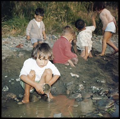 Fiji, Kadavu Island. Children playing on the beach and close up portraits