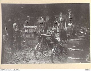 BOUGAINVILLE. 1945-04-06. MEMBERS OF HEADQUARTERS 15 INFANTRY BRIGADE (SIGNALS) UNLOADING EQUIPMENT AT THE NEW BRIGADE POSITION BESIDE THE TOKO-DARARA ROAD. IDENTIFIED PERSONNEL ARE:- SIGNALMAN C. ..