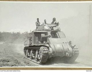 SOUTHPORT, QLD. 1944-01-18. NEW GUINEA POLICE BOYS BEING TAKEN FOR A RIDE IN A GENERAL GRANT M3 MEDIUM TANK BY PERSONNEL OF THE 4TH ARMOURED BRIGADE WITH BRITISH TYPE TURRET