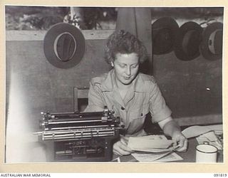 LAE, NEW GUINEA, 1945-05-15. SAPPER J. DUNLOP AT WORK, ENGINEERS, HQ FIRST ARMY. A FEW DAYS AFTER THEIR ARRIVAL FROM AUSTRALIA AWAS PERSONNEL ALLOTTED TO HQ FIRST ARMY TOOK OVER THEIR NEW POSITIONS ..
