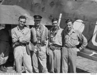 Beaufort crew of No. 100  Squadron RAAF which took part in a raid on Gasmata, Dutch New Guinea, and returned safely despite anti-aircraft (ack ack) damage severing  the elevator control of their ..