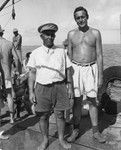 Ben Masters, chief of Palmerston Island, visits with Roger Revelle aboard R/V Spencer F. Baird