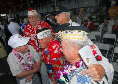 U.S. Navy Survivors of the Dec. 7, 1941 attack on Pearl Harbor greet each other during the joint U.S. Navy/National Park Service ceremony commemorating the 65th anniversary of the attack on Dec. 7, 2006. (U.S. Navy PHOTO by Mass Communication SPECIALIST SEAMAN Daniel A. Barker)