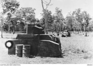 GOODENOUGH ISLAND, NEW GUINEA. 1942-10. TANKS MADE OF HESSIAN ON WOODEN FRAMES AND PLACED IN STRATEGIC POSITIONS WERE PART OF THE BLUFF AND DECEPTION PRACTICED BY A SMALL GROUP OF AUSTRALIANS WHO ..