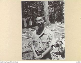 RABAUL AREA, NEW BRITAIN. 1945-09-13. CHINESE CIVILIANS, INTERNED BY THE JAPANESE AT A CAMP 15 MILES WEST OF RABAUL, WERE CONTACTED BY A PARTY OF AUSTRALIAN ARMY AND RED CROSS OFFICIALS SOON AFTER ..
