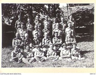 LAE, NEW GUINEA. 1945-11-24. THE STAFF OF THE DEPUTY DIRECTOR OF ELECTRICAL AND MECHANICAL ENGINEERING AT HQ FIRST ARMY. (FOR IDENTIFICATION OF 24 NAMED PERSONNEL REFER TO PROVISIONAL CAPTION OR ..