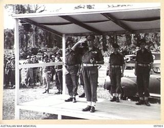 TOROKINA, BOUGAINVILLE. 1945-09-24. MAJOR GENERAL W. BRIDGEFORD, GENERAL OFFICER COMMANDING 3 DIVISION, TAKING THE SALUTE DURING A MARCH PAST OF TROOPS OF 15 INFANTRY BRIGADE. THE PARADE WAS HELD ..