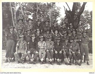 NCOs and other ranks in the Unit Transport Lines at HQ 17 Field Ambulance Transport Lines. Identified in the photograph are: Left to right (front row) VX89987 Sergeant (Sgt) B. C. Fenton; NX93122 ..