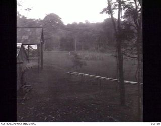 LALOKI VALLEY, NEW GUINEA. 1943-11-05. NO. 1 NCO TRAINING COURSE ON THE PARADE GROUND AT THE JUNIORS' LEADERS WING, NEW GUINEA FORCE TRAINING SCHOOL. NOTE THE PARTIALLY COMPLETED LECTURE ..