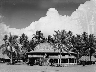 [Man and woman in front of building]