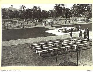 LAE, NEW GUINEA. 1944-04-23. SERVICE PERSONNEL INSPECTING THE LAE WAR CEMETERY AT THE CONCLUSION OF THE DEDICATION CEREMONY CONDUCTED BY NX8 LIEUTENANT-GENERAL SIR LESLIE MORSHEAD, KCB, KBE, CMG, ..