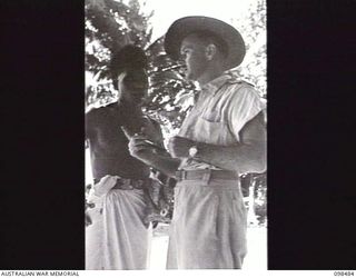 KOIL ISLAND, NEW GUINEA, 1945-10-31. A VISIT TO KOIL ISLAND WAS ARRANGED BY THE RED CROSS FOR THE PURPOSE OF MEDICAL INSPECTION OF THE NATIVE INHABITANTS. THE VISITING PARTY CONSISTED OF AN ..