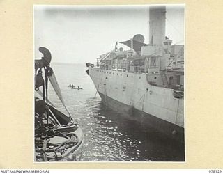 MIOS WUNDI, DUTCH NEW GUINEA. 1944-11-17. THE ROYAL AUSTRALIAN NAVY CORVETTE HMAS GLENELG DRAWING ALONGSIDE THE USS VICTORIA, A UNITED STATES NAVY OIL TANKER, FOR REFUELLING