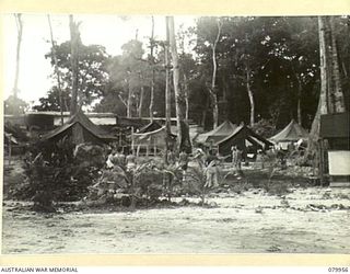 STIRLING ISLAND, TREASURY GROUP. 1945-03-21. THE CAMP LINES, 7TH INFANTRY BATTALION, WITH SOME MEMBERS PLAYING VOLLEY BALL AT THE FOREGROUND