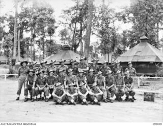 Group portrait of the members of Pioneer Platoon, HQ Company, 27 Infantry Battalion. Left to right, back row: VX147146 Private (Pte) P J Quirk; VX109113 Pte L G Dalton; VX137827 Pte T K Lennox; ..