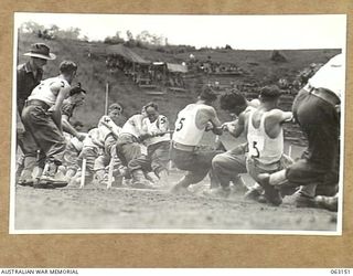 DONADABU, PAPUA, NEW GUINEA. 1944-01-01. THE 15TH INFANTRY BRIGADE HEADQUARTERS TUG-OF-WAR TEAM COMPETING AGAINST THE 15TH INFANTRY BRIGADE GYMKHANA. IDENTIFIED PERSONNEL ARE: SERGEANT I. W. ROPER ..